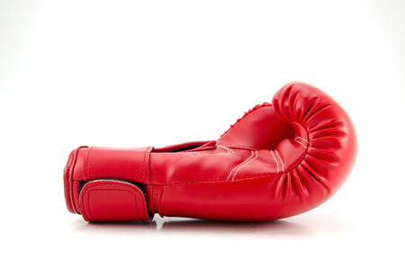A studio shot of a red boxing glove isolated on white backgroundの写真素材