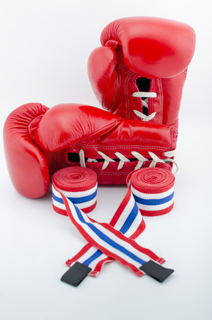 Red boxing gloves and bandages isolated on a white background.の写真素材