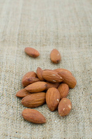 Almonds on hemp cloth backgroundの写真素材