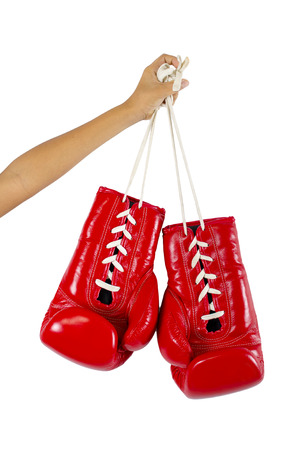 Hand holds a boxing gloveの写真素材