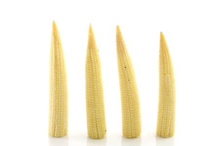 Baby corn isolated in white background の写真素材