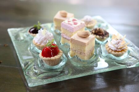 Mini fruit tarts on dish Close-up in shallow DOF の写真素材