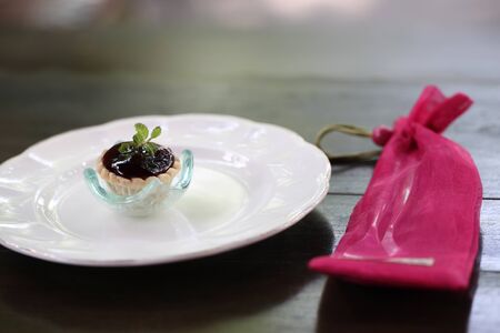 Mini blueberry fruit tarts on dish Close-up in shallow DOF の写真素材