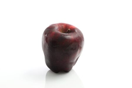 Fresh red apple close up isolated on white background の写真素材