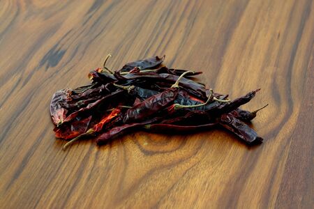 dry chili in wood backgroundの写真素材