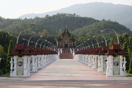 Thai temple pagoda on sunset in Chiangmai Thailand の写真素材