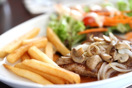 Porkchop on wood backgroundの写真素材