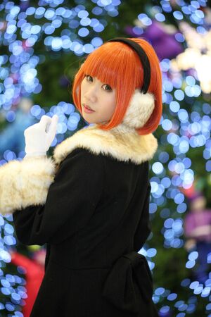 CHIANGMAI, THAILAND - NOV 27: Cosplay festival in Chiangmai. Girl with christmas tree On November 27,2011 in Chiangmai, Thailand. のeditorial素材