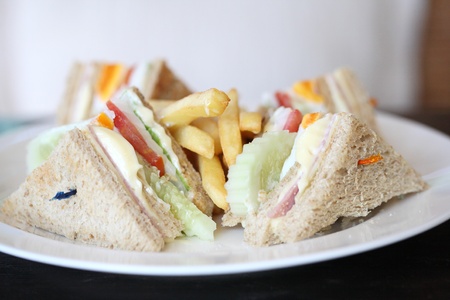 Club sandwich with on wood background