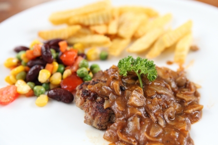 Grilled Porkchop on wood backgroundの写真素材