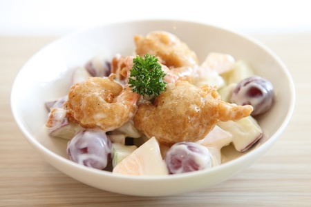 fruit salad on wood backgroundの写真素材