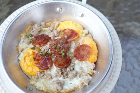 fried egg stuff with hot pan の写真素材