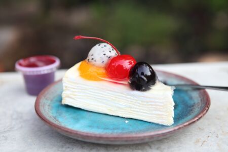 crape cake with strawberry sauceの写真素材