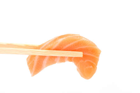 salmon sashimi isolated in white backgroundの写真素材