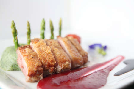 Roasted duck fillet with berry sauceの写真素材