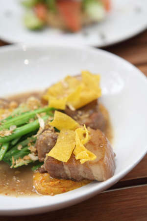 boiled pork roast on white plate の写真素材