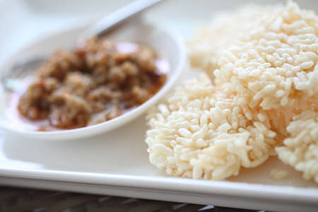 Thai food rice crust with pork spicy sauceの写真素材