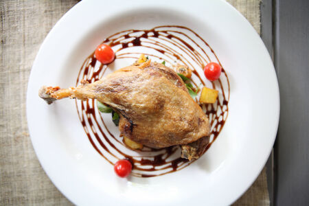 Duck confit , Roasted duck with blueberry sauceの写真素材