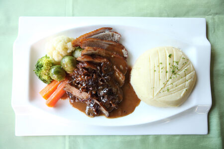 Duck confit , Roasted duck with blueberry sauceの写真素材