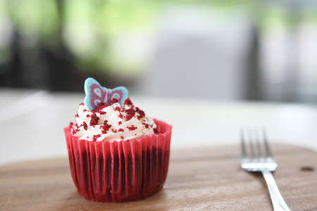 red velvet cupcake on wooden tableの写真素材