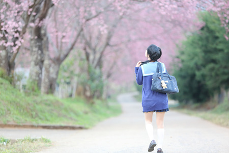 asian schoolgirl with natureの写真素材