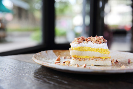 Mango cake with bean on wood backgroundの写真素材