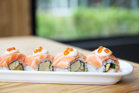 Japanese food Salmon roll on wood backgroundの写真素材