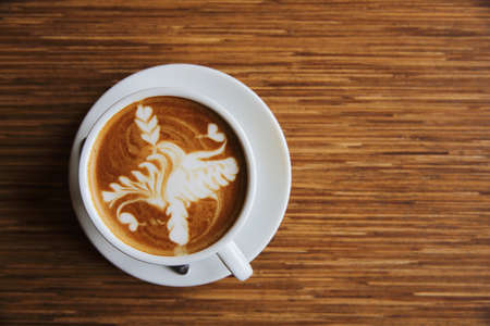 latte coffee on wood backgroundの写真素材
