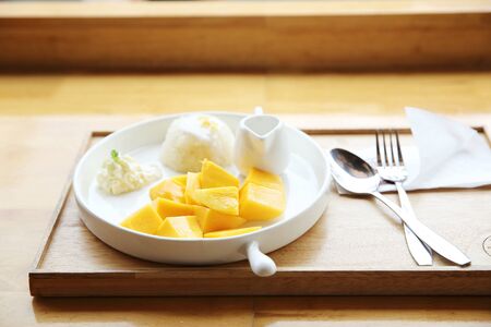 Sticky Rice with Mango on wood backgroundの写真素材