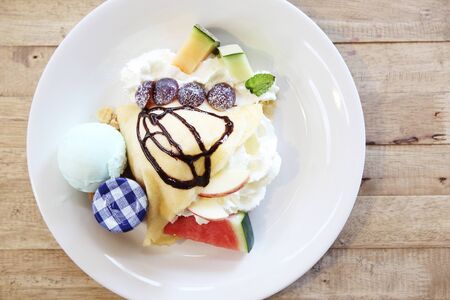 crape cake with fruit and ice creamの写真素材