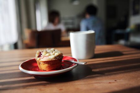 Blueberry muffin with hot tea on wood backgroundの写真素材