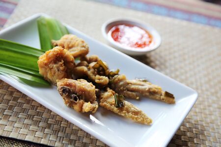 Local food Thai Fried chicken on wood backgroundの写真素材
