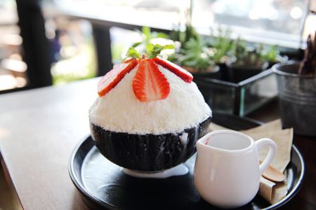 Shaved ice with milk and strawberryの写真素材