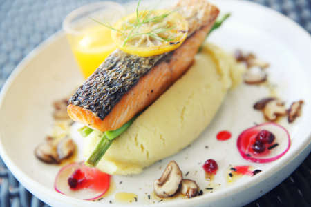 salmon steak with orange sauceの写真素材