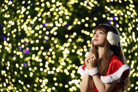 Portrait of beautiful Asian female santa in Christmasの写真素材