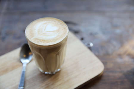 latte coffee on wood backgroundの写真素材