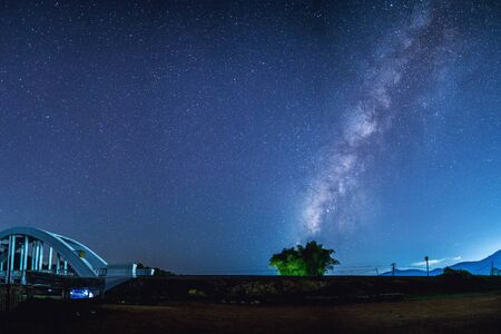 Milky Way with tree and bridgeの写真素材