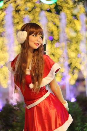 Portrait of beautiful Asian female santa in Christmasの写真素材
