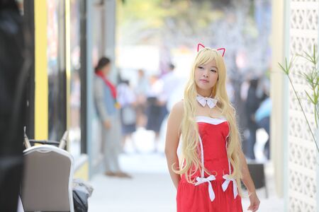 Portrait girl on christmas coat in cityの写真素材