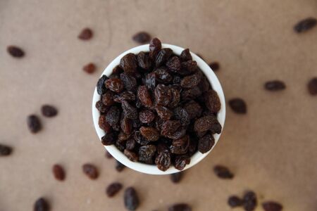 Coffee beans isolated in wood backgroundの写真素材