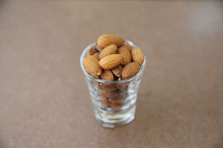 Almonds on wood backgroundの写真素材
