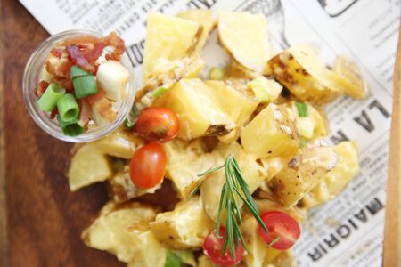 potato salad on wood backgroundの写真素材