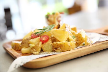 potato salad on wood backgroundの写真素材