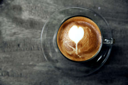 cappuccino coffee on wood background