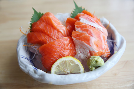 salmon sashimi on wood background japanese foodの写真素材