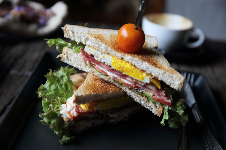 club sandwiches on wood background with mystic lightの写真素材