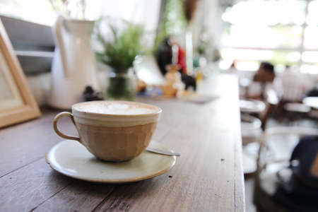cappuccino coffee on wood backgroundの写真素材