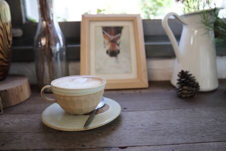 cappuccino coffee on wood backgroundの写真素材