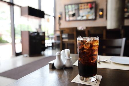 Cola drinking on wood backgroundの写真素材