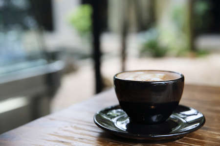 cappuccino coffee on wood backgroundの写真素材